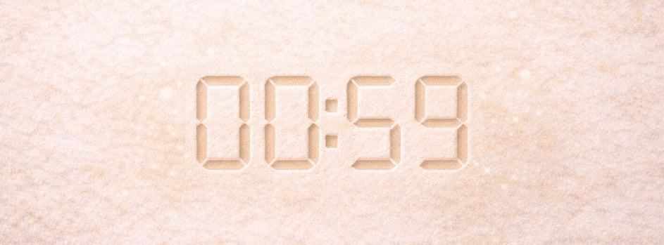 Subtle countdown timer embossed into a neutral sandy background, symbolising timing during endurance running.
